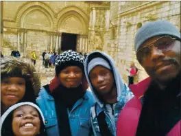  ?? JAYSON E. BROWN VIA AP ?? The Brown family of Atlanta, from left, Jayde Brown, Jay’Elle Brown, Jayson R. Brown, Tammy Brown and Jayson E. Brown at the Church of the Holy Sepulchre in Jerusalem on Dec. 27. Parents Tammy and Jayson have been taking their kids on educationa­l trips for five years and are among families heading out with remote-learning kids during the new school year rather than leaving them stuck at home.