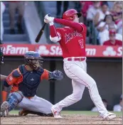  ?? ALEX GALLARDO – THE ASSOCIATED PRESS ?? The Angels' Shohei Ohtani connects for a single during the third inning of Thursday's game against the Astros.