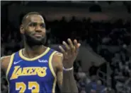  ?? CHRIS SZAGOLA — THE ASSOCIATED PRESS ?? The Lakers’ LeBron James reacts during the second half against the 76ers, Sunday in Philadelph­ia. The 76ers won 143-120.