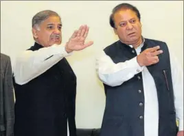  ?? AFP ?? Former Pakistani prime minister Nawaz Sharif (right) and his brother, Punjab chief minister Shahbaz Sharif in Lahore in February 2009.