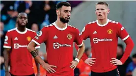  ?? GETTY IMAGES ?? Off the pace: Wan-Bissaka, Fernandes and McTominay