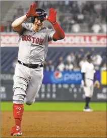  ?? Justin Lane EPA / Shuttersto­ck ?? BROCK HOLT celebrates his Game 3 home run against the Yankees. Holt hit for the cycle in Boston’s 16-1 romp.