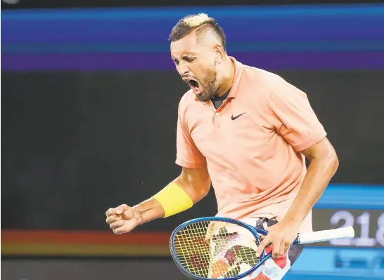  ?? DAVID GRAY/AFP VIA GETTY ?? Nick Kyrgios celebrates his victory over Gilles Simon on Thursday at the Australian Open.