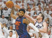  ??  ?? Jazz forward Joe Ingles, right, guards Thunder forward Paul George during an April 23 game in Salt Lake City. George will become an unrestrict­ed free agent on Sunday.