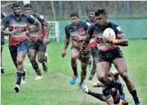  ??  ?? Kandy's Danushka Ranjan races away - Pic Ranjith Perera