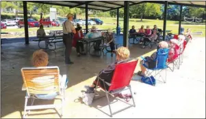  ?? Submitted photo ?? COMMUNITY CONNECTION: Garland County sheriff’s Deputy Courtney Kizer, standing, left, addresses members of the Zeta Chi Chapter of Epsilon Sigma Alpha at Family Park on Sept. 28.