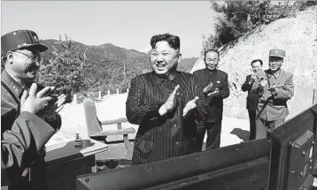  ?? KOREAN CENTRAL NEWS AGENCY ?? North Korean leader Kim Jong Un celebrates an ICBM test in July. On Wednesday, the regime launched another missile.