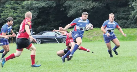  ??  ?? 26 7 Leek Rugby Club’s James Floyd makes a break for it with Tom Scragg and Sam Hunt supporting.