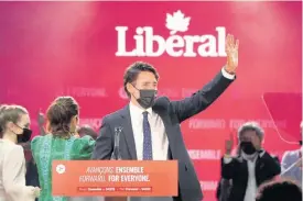  ?? AP ?? Liberal Leader Justin Trudeau greets supporters prior to his victory speech at party campaign headquarte­rs in Montreal, Canada, yesterday.