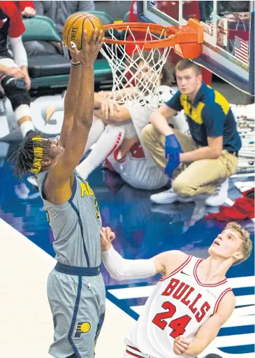  ?? EPA ?? Bulls forward Lauri Markkanen, right, watches as Pacers centre Myles Turner shoots.