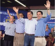  ?? ASSOCIATED PRESS ?? Wisconsini­tes (from left) Reince Priebus, Paul Ryan and Scott Walker (right) share the stage with Mitt Romney during a campaign stop in 2012. At the time, the “Big Three” were building what became known as the Cheesehead Revolution in the Republican Party.