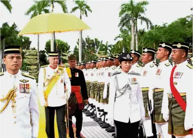  ?? — Bernama ?? Royal inspection: Sultan Nazrin observing the guard of honour at the state-level Warriors’ Day celebratio­n at Dataran Bangunan Perak Darul Ridzuan.