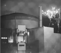  ??  ?? View of fireworks in an image from a video grab provided by Greenpeace at the Cattenom nuclear power site run by France’s EDF, during an action by Greenpeace activists to protest against security and health risks posed by nuclear power, in Cattenon. —...