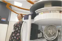  ?? ?? Leah Thorp, the SHA'S director of education and research with maternal and children's programs, checks out the new pediatric MRI machine at the Pattison hospital. Doctors say it will improve patient care.