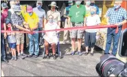  ?? RON DEVLIN — MEDIANEWS GROUP ?? Descendant­s of the Dreibelbis family cut the ribbon during a dedication ceremony Aug. 21 at the rehabilita­ted and reopened Dreibelbis Station Covered Bridge in northeast Berks County.