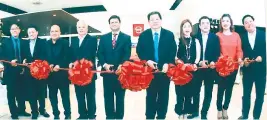  ??  ?? NISSAN CEBU SOUTH RIBBON CUTTERS. From left are regional executive officer after sales Niel Ballares, Nissan Philippine­s Inc. (NPI) manager, dealer developmen­t Francis Ang, NPI after sales general manager Abner Berdos, NPI sales general manager Roland...