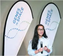  ?? Christophe­r Pike / The National ?? Alia Al Mansoori, 14, winner of the Genes in Space competitio­n, makes her presentati­on yesterday.