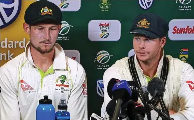  ??  ?? Shameful: Aussies Bancroft and Smith face the media after the ball-tampering scandal