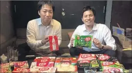  ?? Jonathan Kaiman Los Angeles Times ?? RYOJI MAKI, KitKat’s marketing manager in Japan, left, with Nestle Japan spokesman Takuya Hiramatsu, has developed several varieties of the popular bar.