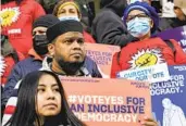  ?? MARY ALTAFFER AP ?? Activists encourage the New York City Council to allow lawful permanent residents to vote.