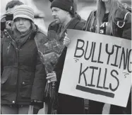  ?? ANDREW VAUGHAN/ THE CANADIAN PRESS ?? Leah Parsons, left, mother of Rehtaeh Parsons, and her partner, Jason Barnes, attend a protest in Halifax on Sunday.