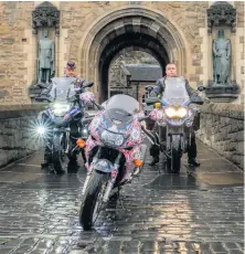  ??  ?? On their bikes Calum and Jason raising awareness