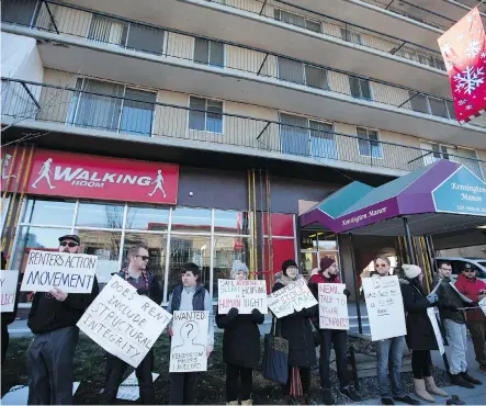  ?? LEAH HENNEL ?? Residents and members of Renters Action Movement demand better protection­s for tenants outside Kensington Manor on Saturday.