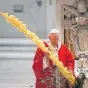  ??  ?? Pope Francis gathers his thoughts while holding a palm branch as he celebrates Palm Sunday Mass behind closed doors at St. Peter’s Basilica in the Vatican on Sunday.