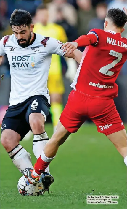  ?? ?? Derby County’s Eiran Cashin (left) is challenged by Barnsley’s Jordan Williams.