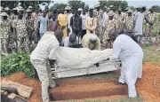  ?? AFP ?? The body of a victim of the attack is buried in Maiduguri on Saturday.