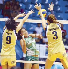  ?? JOEY MENDOZA JR. ?? Jaja Santiago of National University, with help from teammate Aiko Sweet Urdas, blocks a kill from Mylene Paat of Laoag in the opener of the Shakey’s V-League Season 13 Open Conference yesterday at the San Juan Arena.