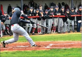  ??  ?? Above: Frank Lizzie strokes a base hit for the Glenn baseball team.