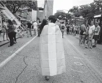  ?? Yi-Chin Lee / Staff file photo ?? Leon Burgher, 15, wears a transgende­r pride flag at Pride Houston in 2017. Texas has the second-largest trans population in the U.S.