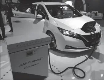  ?? TRIBUNE NEWS SERVICE ?? The 2018 Nissan Leaf was on display at Cobo Center in Detroit on Sept. 6. The latest version of the Leaf electric vehicle can travel 150 miles on a charge.