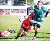  ??  ?? Slick hands: Stephen Myler puts in Topsy Ojo’s try