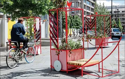  ?? ?? Urban forests: Wayward installed market “barrows” planted with tree saplings across Aldgate and Cheapside for LFA 2022