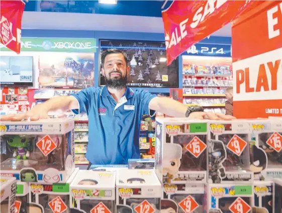  ?? Picture: MARK CRANITCH ?? Dan Cheung, who is Store Manager at EB Games in Albert St, Brisbane. EB Games has been named one of the country's top retailers.