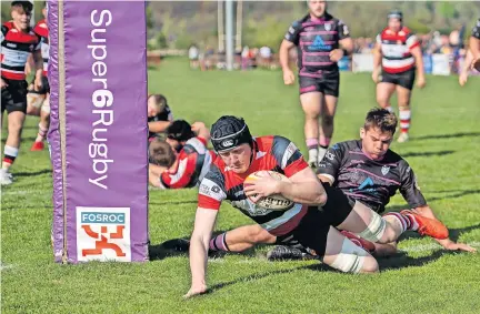  ?? ?? Try George Arnott scores for Stirling County. All photos by Bryan Robertson Photograph­y