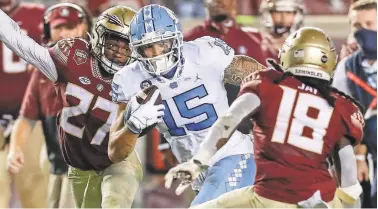  ?? DON JUAN MOORE/CHARACTER LINES ?? UNC senior receiver Beau Corrales (15), who had four catches for 141 yards and a touchdown in last week’s loss at Florida State, is one of several weapons available to quarterbac­k Sam Howell.