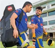  ?? CSK ?? Chennai Super Kings captain M. S. Dhoni (left) and Suresh Raina chat during a training session.