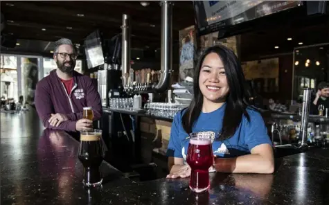  ?? Jose F. Moreno/Philadelph­ia Inquirer ?? Celeste and Tom Revelli, at Urban Village Brewing in Philadelph­ia, managed to pay down six figures in student debt and get married. Mr. Revelli opened the brewery with a co-owner; Mrs. Revelli works as director of financial planning at eMoney Advisor.