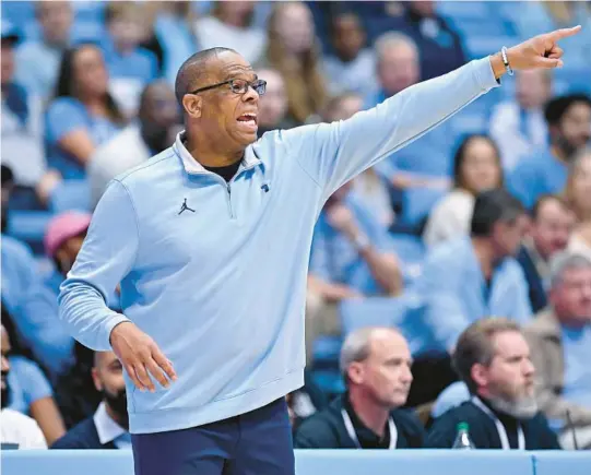  ?? GRANT HALVERSON/GETTY ?? North Carolina coach Hubert Davis directs his team in an exhibition on Oct. 28 in Chapel Hill, N.C. After a thrilling run to the championsh­ip game last season, the Tar Heels enter this year as the No. 1 team in America.