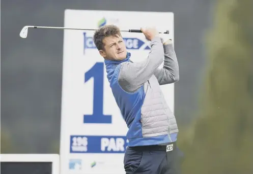  ??  ?? David Law tees off at the 10th at Macdonald Spey Valley on his way to a five-under-par 66 in the SSE Scottish Hydro Challenge.