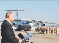  ?? AP PHOTO ?? In this file photo taken on Tuesday, Dec. 12, 2017, Russian President Vladimir Putin addresses the troops at the Hemeimeem air base in Syria. Several private Russian military contractor­s were killed by a U.S. strike in Syria, Russian media reported...