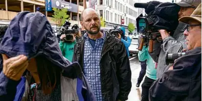  ?? STEVEN SENNE/ASSOCIATED PRESS ?? Jack Michael Teixeira (center), father of Jack D. Teixeira, arrived at federal court Thursday.