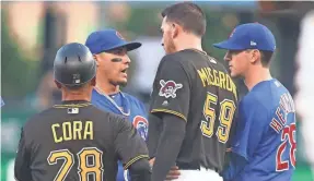  ?? CHARLES LECLAIRE/USA TODAY ?? When Pirates pitcher Joe Musgrove slid hard into Cubs second baseman Javy Baez, left, it again ignited tensions between the teams.