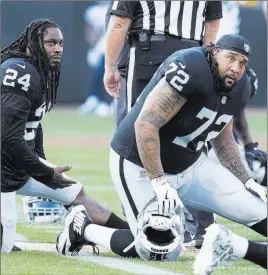  ??  ?? Heidi Fang Las Vegas Review-journal @Heidifang Running back Marshawn Lynch (24) and offensive tackle Donald Penn (72) warm up before the Raiders’ final exhibition game.