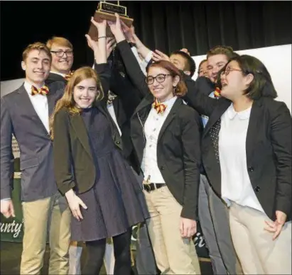  ?? SUBMITTED PHOTO ?? The Haverford High School Hi-Q team hoists the 2017-18 season trophy. It marked back-to-back wins for young scholars from Haverford. the