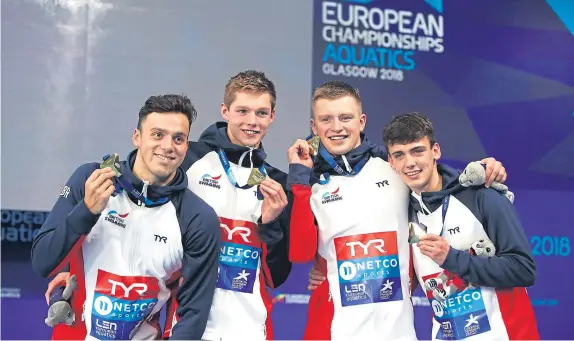  ?? Picture: Getty. ?? Nicholas Pyle, James Guy, Adam Peaty and Duncan Scott celebrate their gold medals in the men’s 4x100m medley relay.