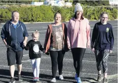  ?? PHOTO: LINDA ROBERTSON ?? Walking the talk . . . Terminal bowel cancer patient Toni AdieKinrai­d (centre) with (from left) husband Shaun AdieKinrai­d, daughter Ruby AdieKinrai­d (5), sister Michelle Abernethy and daughter Anashai Kinraid (17). Mrs Abernethy and Anashai are walking the Dunedin Half Marathon to raise funds for Bowel Cancer New Zealand.